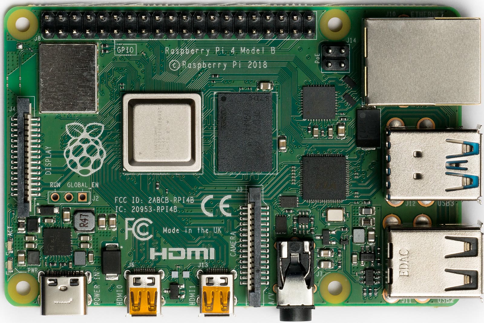 Top view of a Raspberry Pi 4 board with processor, memory package, and display connectors